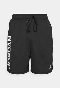 Black mesh athletic shorts with an elastic waistband and drawstring. Features white "JORDAN" text on the side and a logo near the hem.