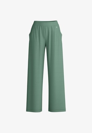 Wijde, hoge taille, losvallende broek in gedempt groen met zijzakken en een klein cirkelvormig logo nabij de tailleband.