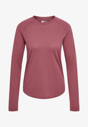 Langærmet atletisk skjorte i en afdæmpet rosafarve, lavet af et tekstureret, åndbart stof. Har afrundet kant og raglanærmer.