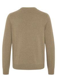Beige knit sweater, long sleeves, crew neck, ribbed cuffs and hem. Soft texture with a smooth finish, no visible patterns or accents.