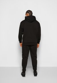 Calvin Klein MICRO LOGO JOGGER - Træningsbukser - black