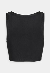 Black ribbed crop top featuring a high neckline and wide armholes. The fabric has a textured finish with vertical stripes.