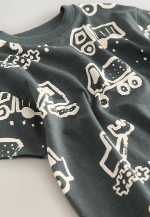 Mørkegrå bomulds langærmet skjorte med hvide grafiske mønstre af køretøjer og værktøjer. Rund halsudskæring med ribbet kant.