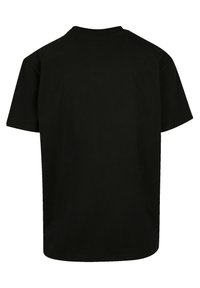 Schwarzes Kurzarm-T-Shirt mit klassischem Rundhalsausschnitt. Hergestellt aus glattem, weichem Stoff, bietet es eine lässige Passform und einen geraden Saum. Keine Grafiken oder Muster.