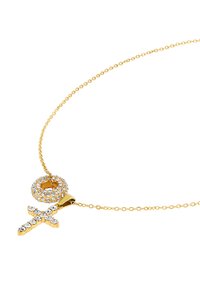 Gouden ketting met een ronde hanger versierd met heldere kristallen en een vrouwen symbool dat is aangekleed met extra kristallen.