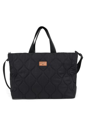 Black quilted tote bag with dual handles, adjustable shoulder strap, and small rectangular leather patch labeled "MUSTANG" on front.