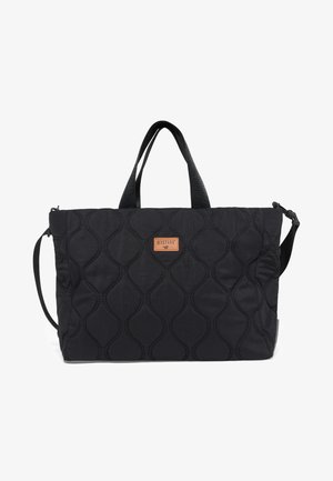 Black quilted tote bag with dual handles, adjustable shoulder strap, and small rectangular leather patch labeled "MUSTANG" on front.