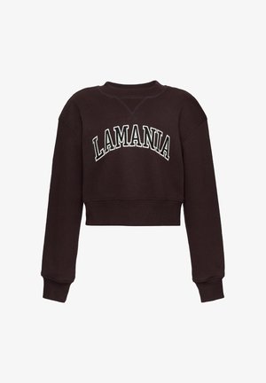 Ciemnobrązowa krótka bluza z długimi rękawami, z napisem "LAMANIA" w dużych, białych, obrysowanych literach na piersi.