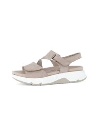 Beige suede sandals with a wide strap design, an adjustable buckle, and a thick white sole with a grey base. Smooth texture, open toe style.