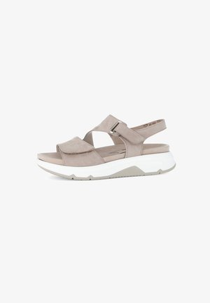 Light grey suede sandal with cross-strap design, adjustable buckle, and white rubber sole featuring a textured bottom for grip.