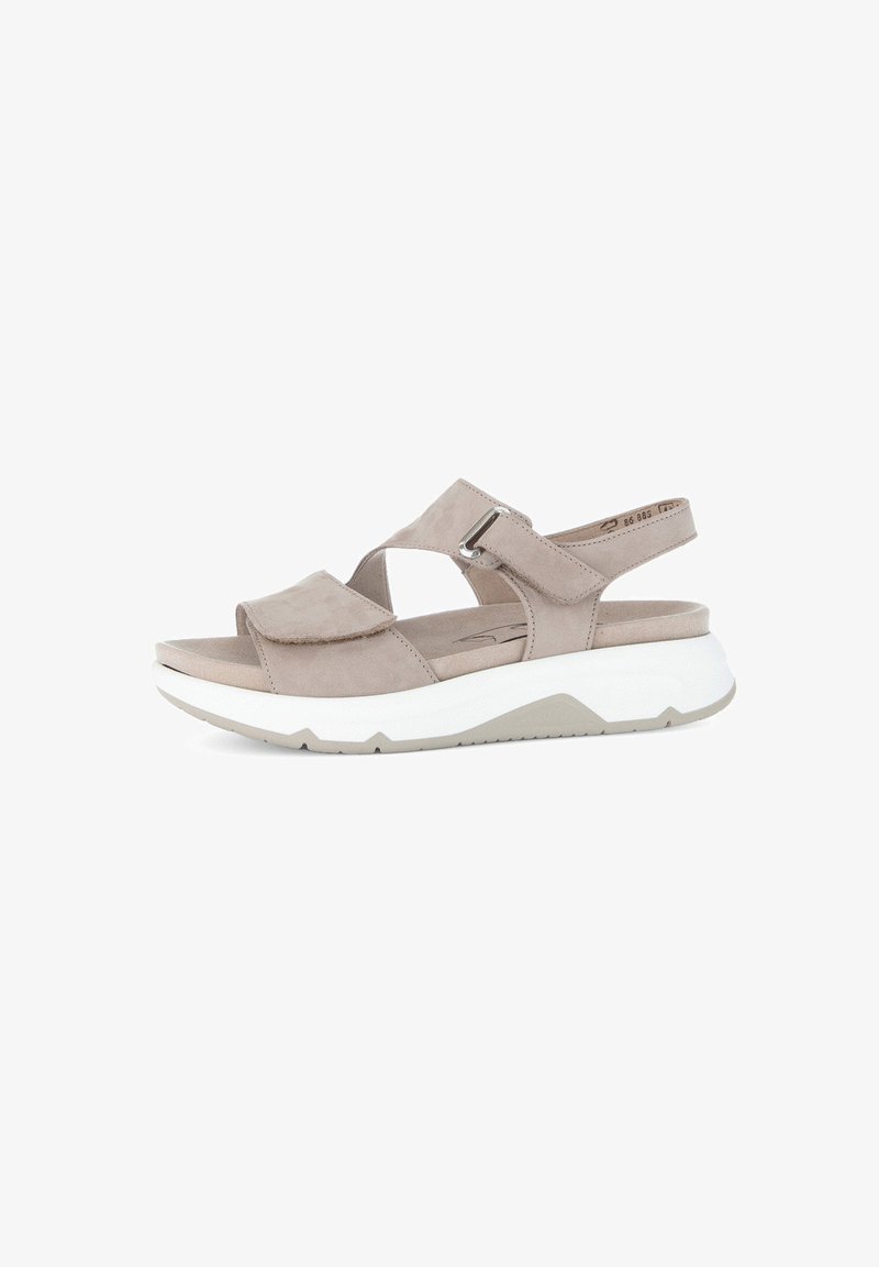 Beige suede sandals with a wide strap design, an adjustable buckle, and a thick white sole with a grey base. Smooth texture, open toe style.