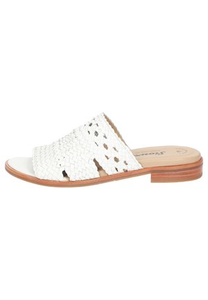 White woven leather slide sandal with an open design, flat wooden sole, and subtle stitching details. Smooth inner lining for comfort.