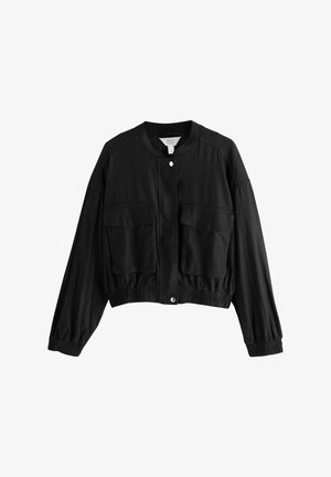 Black cropped jacket made of lightweight material featuring a round neckline, two front pockets, elastic cuffs, and a snap button closure.