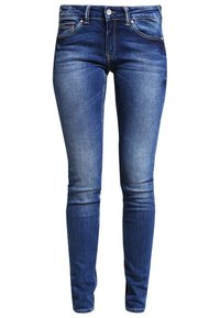 Blå denim skinny jeans med en urtvättad finish, med en medelhög midja, fem fickor och en metallknappstängning.