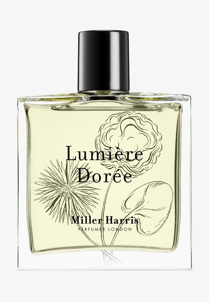 Klares, quadratisches Parfümfläschchen mit blassgelber Flüssigkeit, schwarzem Verschluss, floraler Linienzeichnung und dem Text "Lumiere Dorée Miller Harris" auf der Vorderseite.