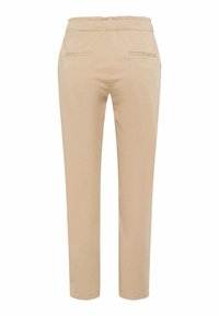 Pantalon beige à jambes droites avec taille élastique et deux poches fendues à l'arrière, vu de dos sur un fond blanc.
