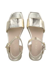 Gold metallic sandals featuring a wide front strap, square toe, and slim ankle strap with a metallic buckle. Smooth texture and shiny finish.
