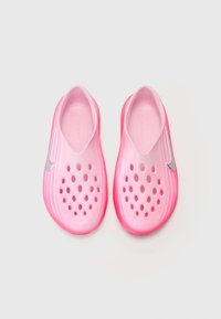Pink slip-on shoes with a smooth texture, featuring ventilation holes and a reflective silver accent on the side. Rubber material, lightweight design.