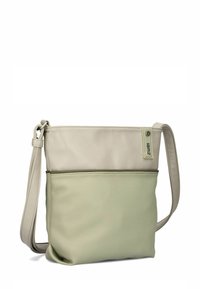 Borsa a tracolla bicolore beige e verde chiaro con tracolla regolabile e dettaglio cerniera visibile sulla tasca anteriore.
