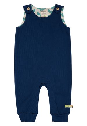 Articolo in cotone a coste di colore blu navy, con dettagli in legno e un rivestimento interno a motivo con forme azzurre. Polsini elastici alle caviglie.