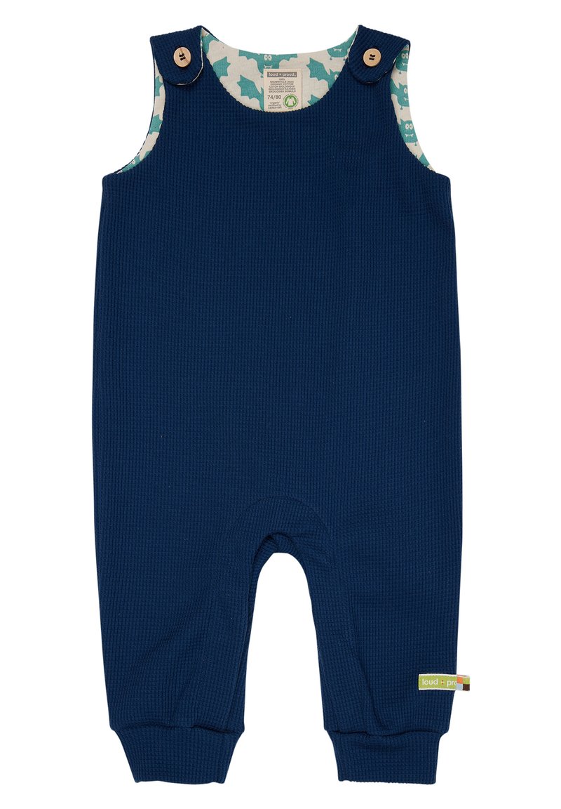 Articolo in cotone a coste di colore blu navy, con dettagli in legno e un rivestimento interno a motivo con forme azzurre. Polsini elastici alle caviglie.
