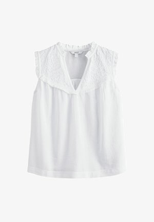 Hvid ærmeløs top med broderede detaljer på skulderen, V-udskæring og indsamlede plisseringer, lavet af et let, tekstureret stof.