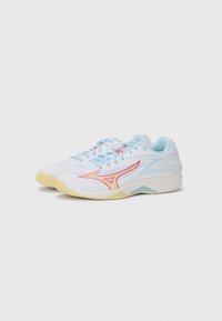 White athletic shoes with blue accents and a red logo. Features a textured sole and padded collar for comfort, lightweight design.