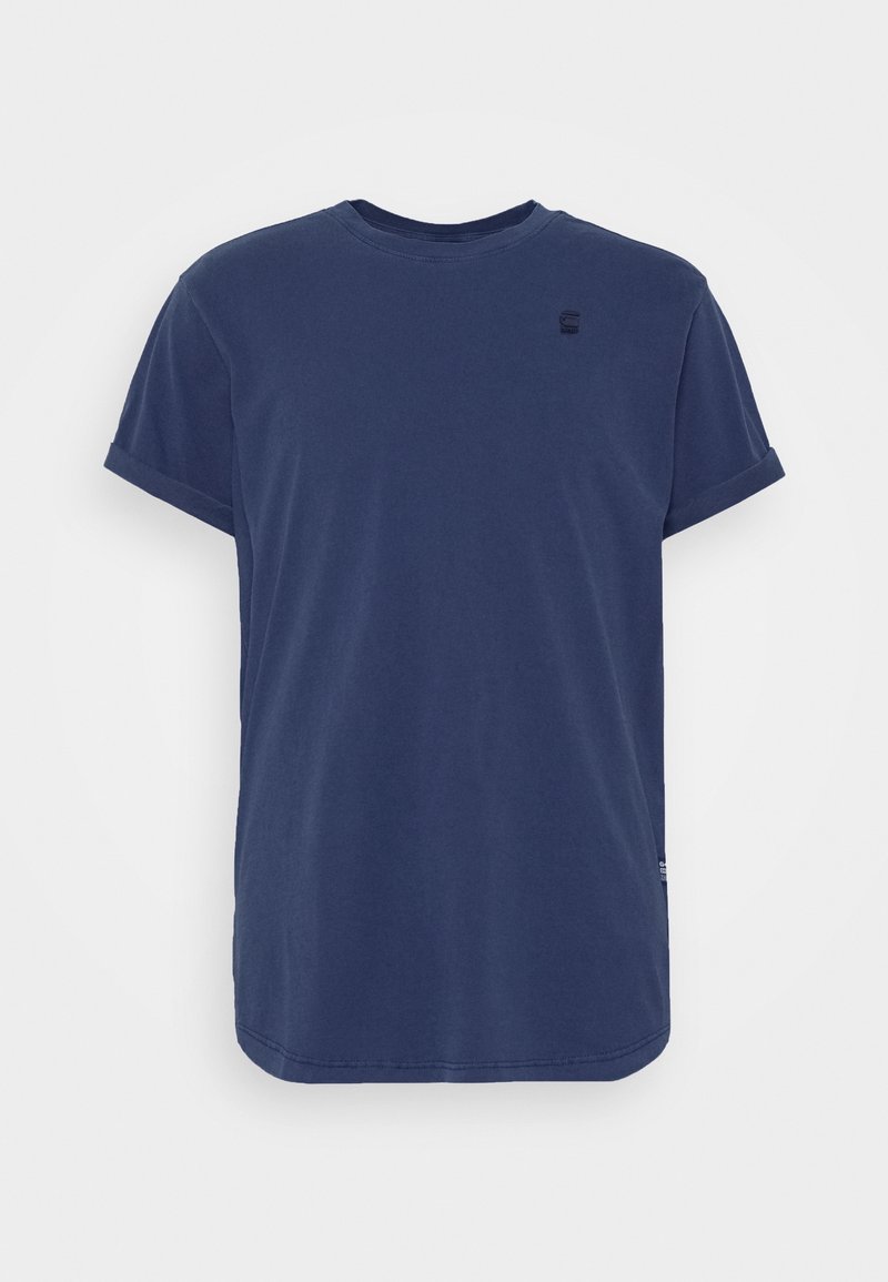 T-shirt en coton bleu marine à manches courtes, avec revers roulés et petit logo côté gauche de la poitrine.