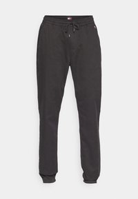 Svarta joggarbyxor i lätt material, med elastisk midja och dragsko, smala ben och elastiska manschetter vid anklarna.