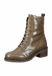 Bottines chelsea en cuir marron à lacets avec une finition brillante, bout rond et talon empilé. Présentent des accents texturés et des coutures contrastées.