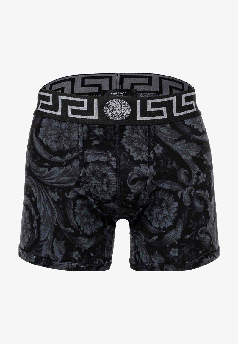 Boxer-briefs noirs avec un motif floral dans des teintes plus foncées, une taille élastique avec un design en clé grecque, et un détail de logo.
