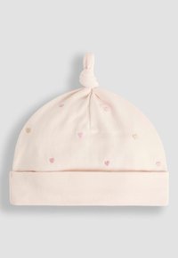 Bonnet en coton rose pour bébé avec un nœud sur le dessus, comportant de petits cœurs brodés en rose clair et beige. Texture douce et confortable, avec un revers.