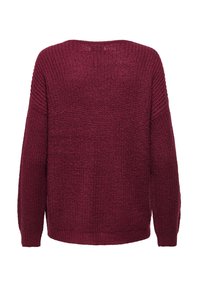 Maglione in maglia bordeaux con finitura texturizzata, spalle scese e orlo a costine. Presenta una vestibilità ampia e rilassata con fessure laterali.