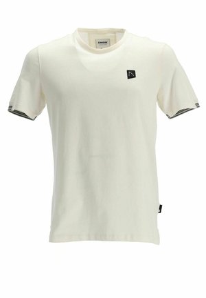 T-shirt couleur crème en coton doux. Dispose d'un écusson noir avec logo et d'accents rayés sur les manches. Conception classique à col rond.