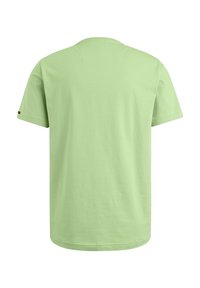 Camiseta de manga corta de algodón en verde claro. Diseño clásico de cuello redondo con una textura suave y sin patrones. Dobladillo recto. Estilo minimalista.