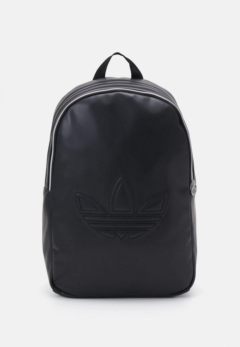 Black backpack made of smooth material. Features a textured logo print, dual top zippers, and a fabric carry handle on top.