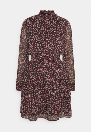 Svart blommig klänning med långa ärmar, volangad hög krage, elastisk midja och lager av frill. Utsmyckad med små rosa och vita blommor.