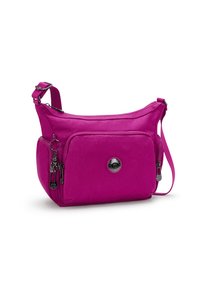 Borsa a tracolla fucsia realizzata in tessuto resistente, dotata di un compartimento principale con zip, tasca frontale e un portachiavi decorativo. Spallaccio regolabile.