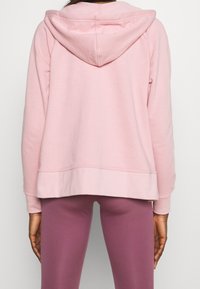 Nike Performance Felpa con zip - pink