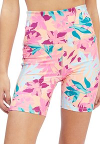 Shorts da bicicletta a vita alta, multicolori, con motivo floreale in tonalità di rosa, verde teal e viola; realizzati in tessuto elasticizzato e liscio.