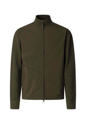Veste zippée pour homme de couleur vert olive foncé avec un col montant et des manches longues, présentant des textures de tissus mélangés sur le corps et les bras.