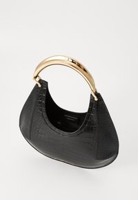 Black handbag with a crocodile texture, curved shape, and a shiny gold metal handle. Interior includes a zip pocket and embossed logo details.
