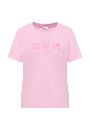 T-shirt rose pâle à manches courtes avec col rond, présentant un design géométrique abstrait et un texte français centré sur la poitrine.
