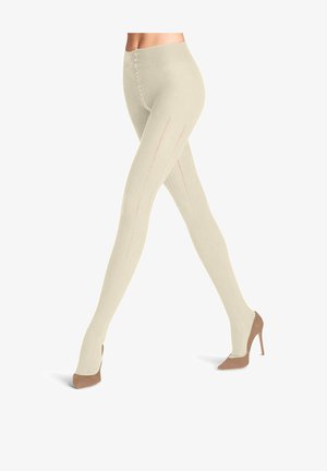 Collant alti fino al ginocchio in maglia beige chiaro, con costine verticali e dettagli di cucitura rosa delicati. Indossati con tacchi color taupe.