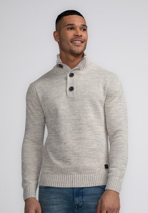 Light gray knitted sweater with a high collar, featuring two black buttons and ribbed cuffs and hem. Smooth texture with subtle pattern.