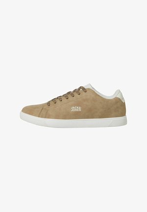 Beige suede sneaker with white rubber sole, round toe, brown laces, and small logo on the side. Smooth texture and minimal design accents.