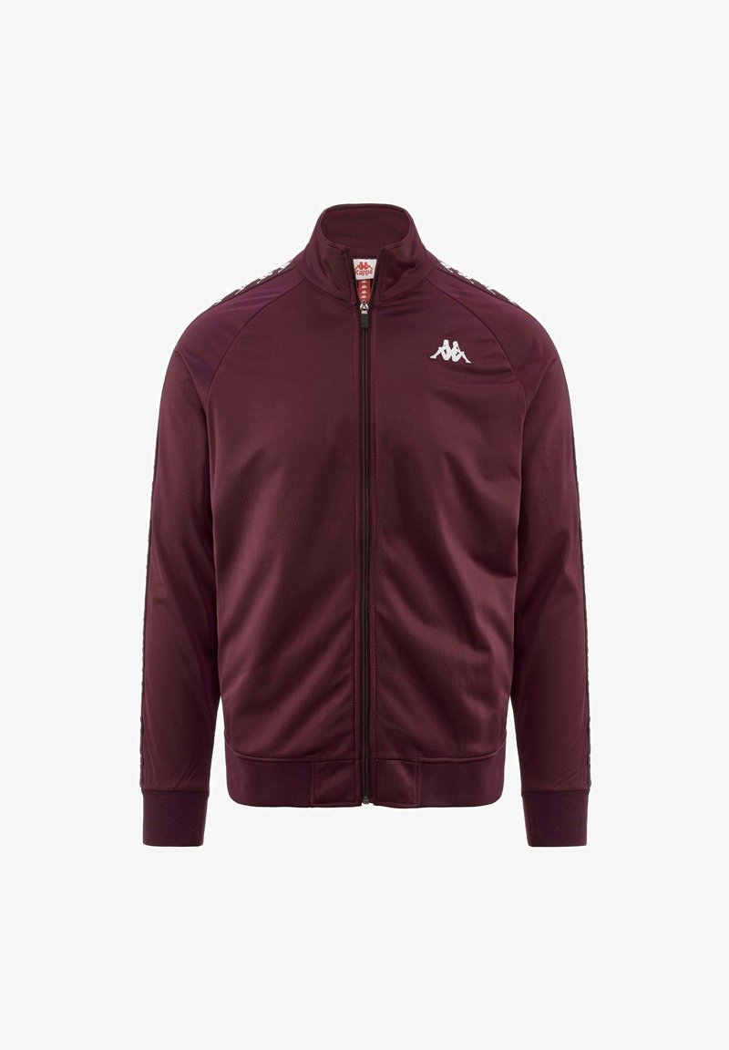 Giacca sportiva bordeaux con colletto alto, chiusura con zip, polsini a costine e dettagli laterali a strisce bianche. Realizzata in tessuto liscio e leggero.