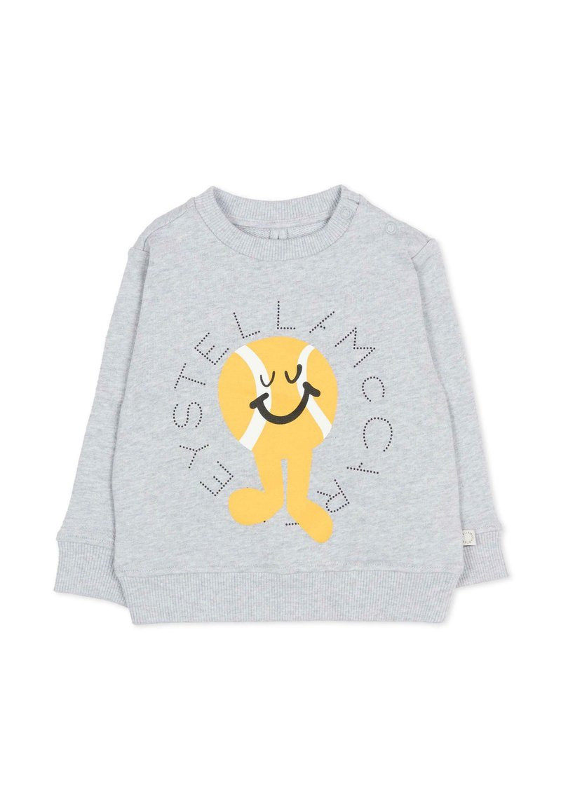 Felpa grigia chiara per bambini con un personaggio di pallina da tennis gialla sorridente e la scritta "Stella McCartney" intorno.