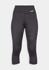 Mustad kapri retuus elastsemast kangast kõrge vöökoht, millel on külgedel kolm horisontaalset tekstuuri triipu.