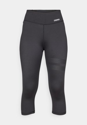 Black capri leggings made of stretchy fabric with a high waistband, featuring three horizontal textured stripes on the side.